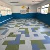 Instalación de piso vinílico VCT en Colegio de Til Til